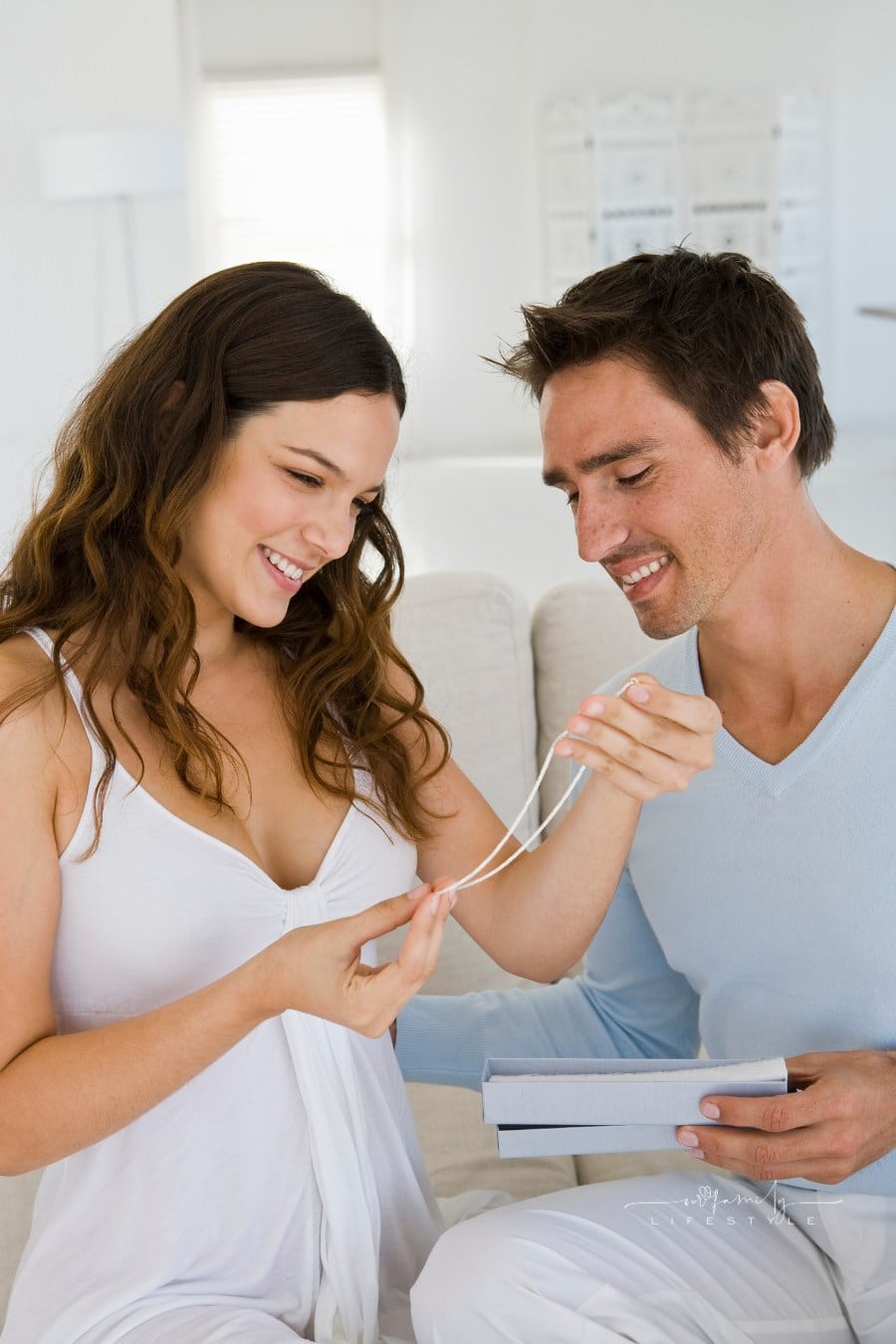 Man giving woman jewelry box