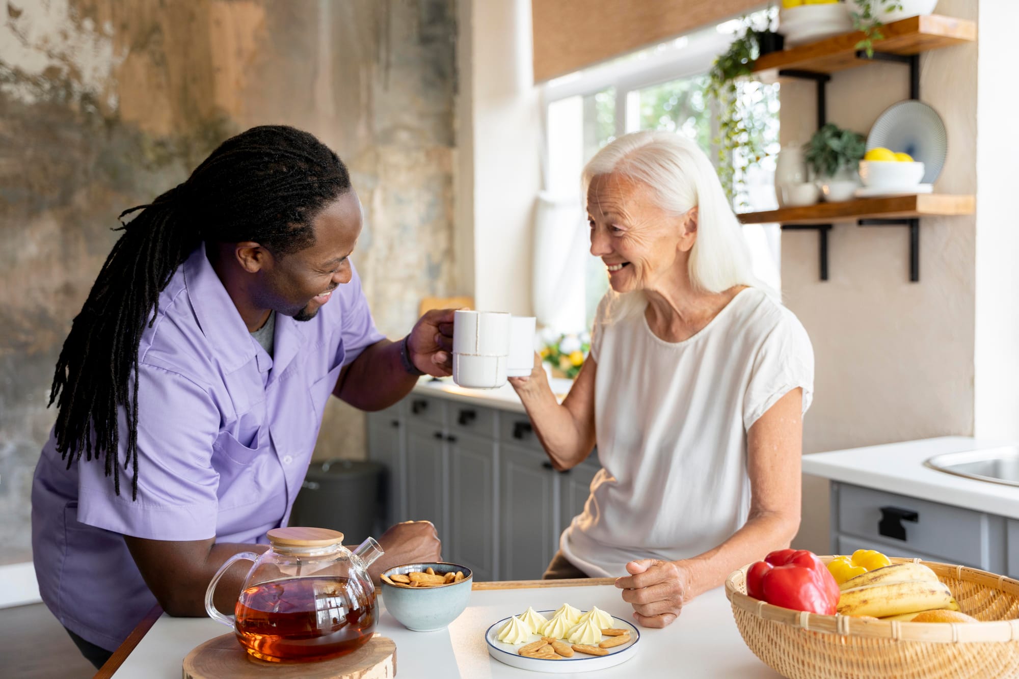 Male social worker taking care of an old woman