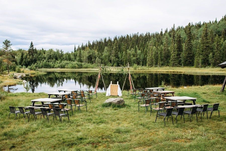 beautiful Garden Wedding set in a clearing with a lake background