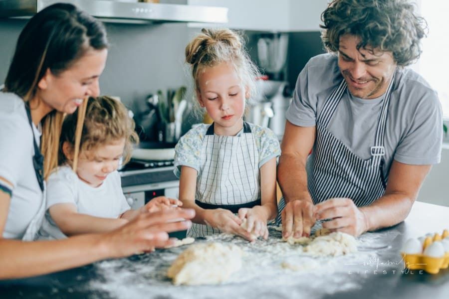 Young family having fun in the kitchen