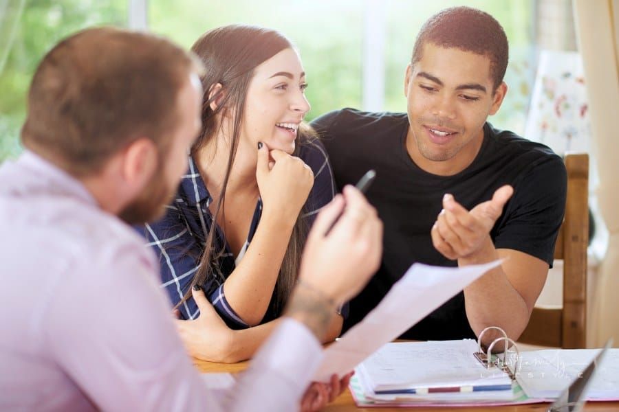 landlord and tenants going over rental contract