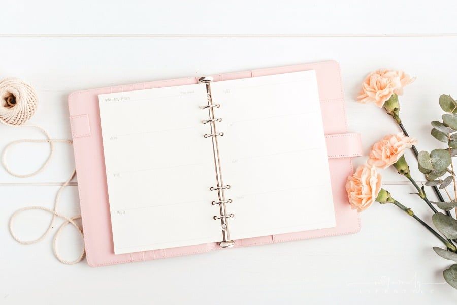 open pink planner with flowers