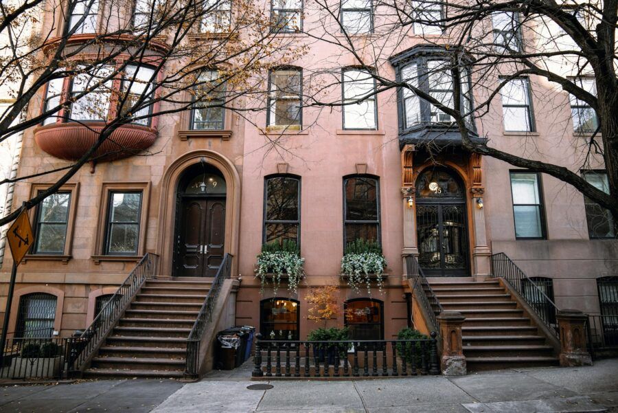 Brownstone buildings in Brooklyn, New York, showcasing autumn charm.