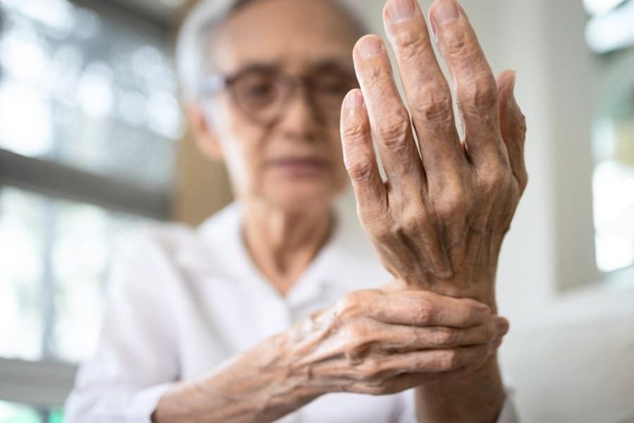 Elderly female patient suffer from numbing pain in hand
