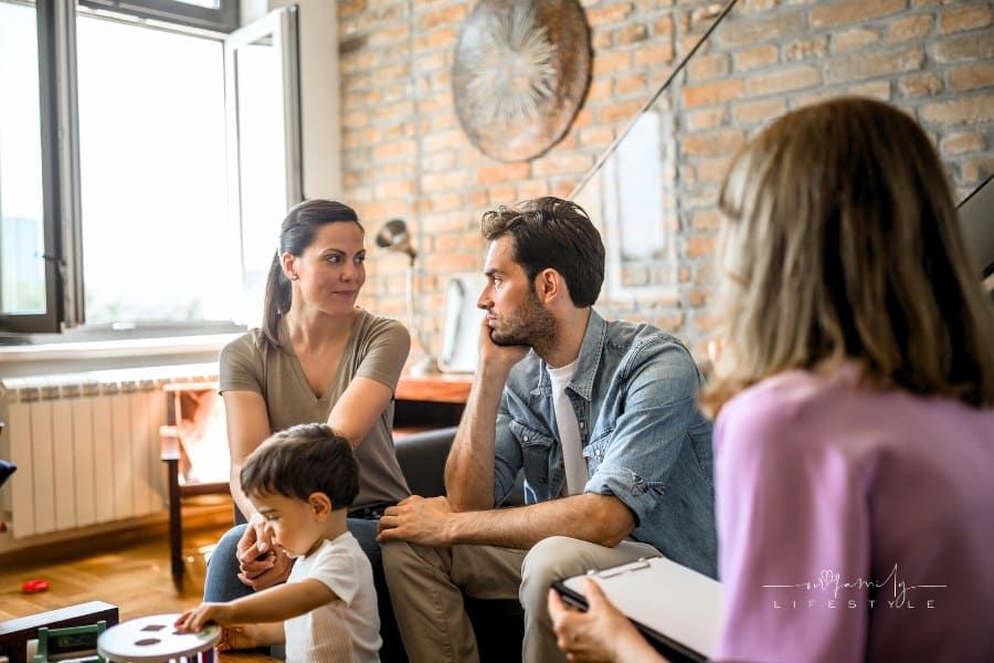 Young couple with a child in a couples therapy session