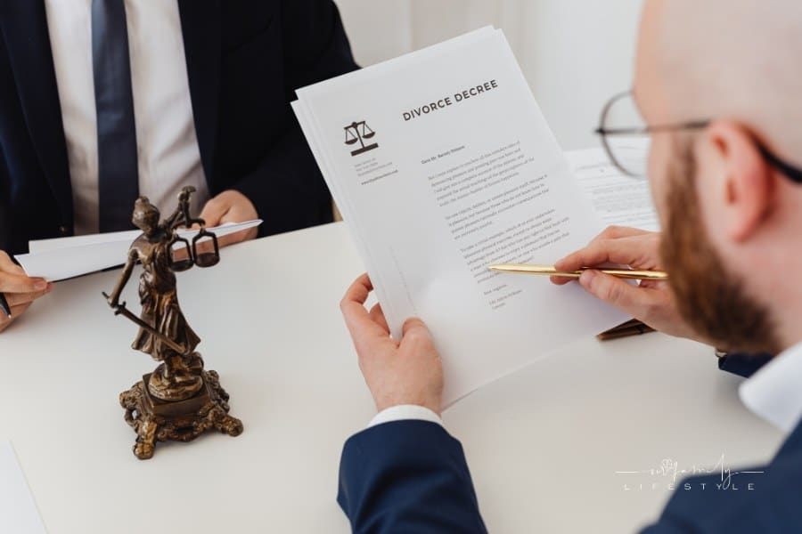 A Person Holding Divorce Decree Documents