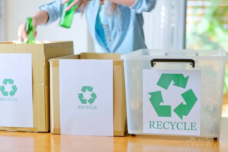 woman separating trash for recycling