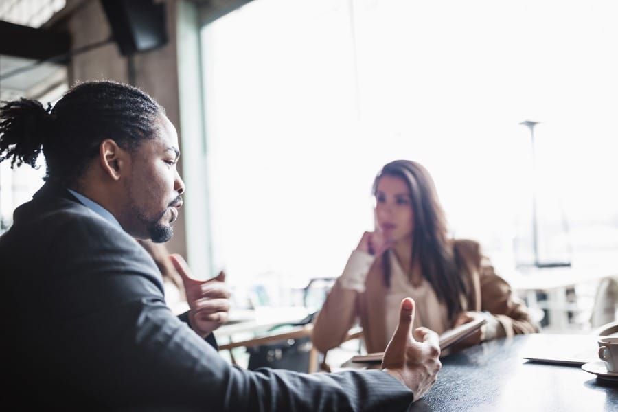 man talking to businesswoman during a job interview
