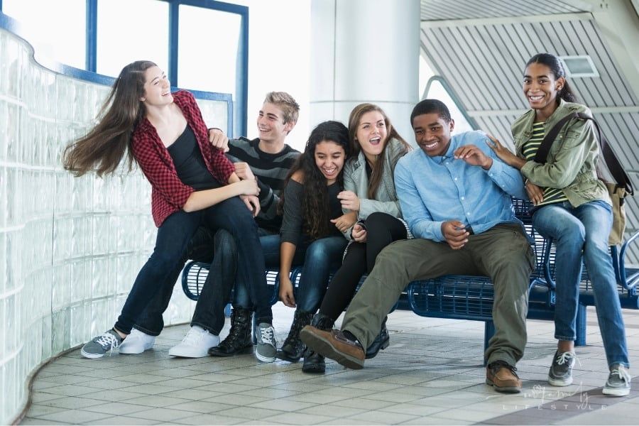 group of teen friends having fun together