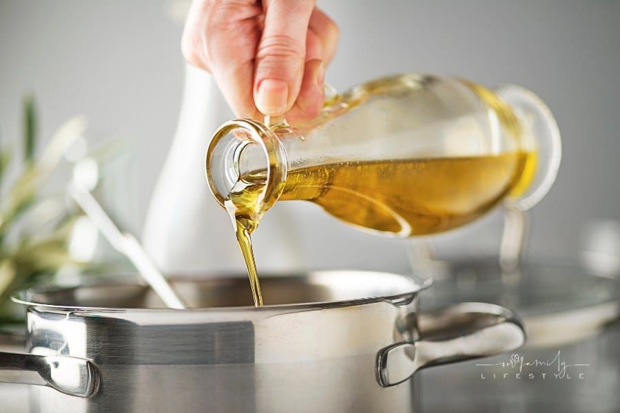 pouring olive oil in pot