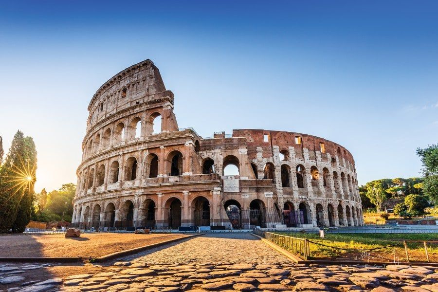 Rome, Italy. The Roman Colosseum or Coliseum at sunrise.