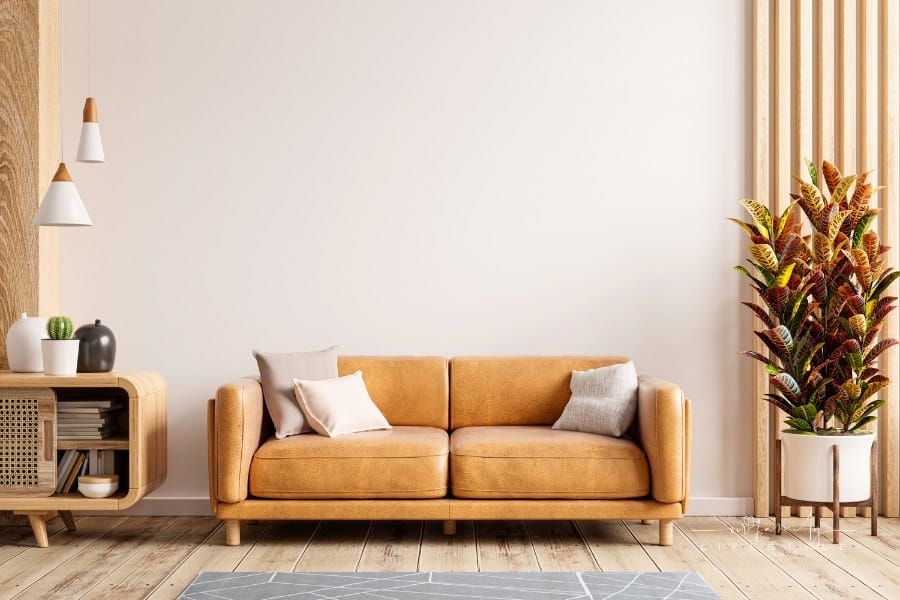 Interior living room with leather sofa and midcentury modern furniture