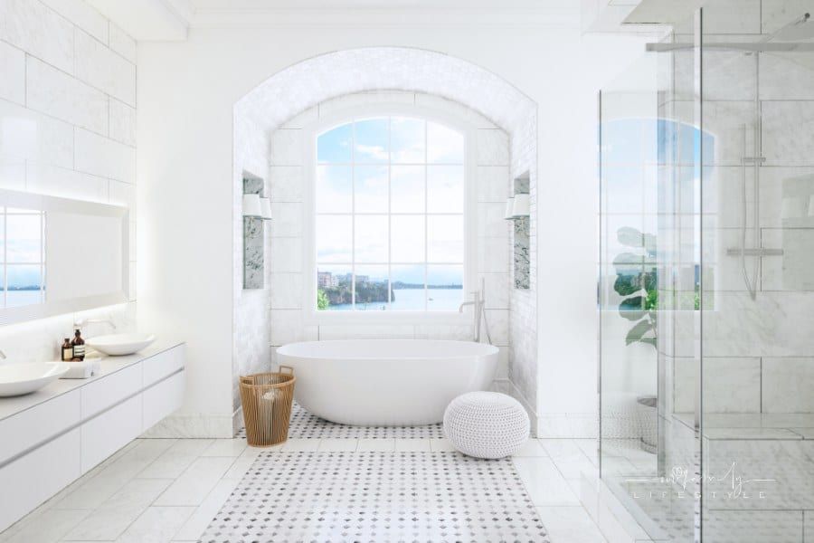 Modern luxury white bathroom with stand alone tub, wall-mounted vanity, and frameless shower