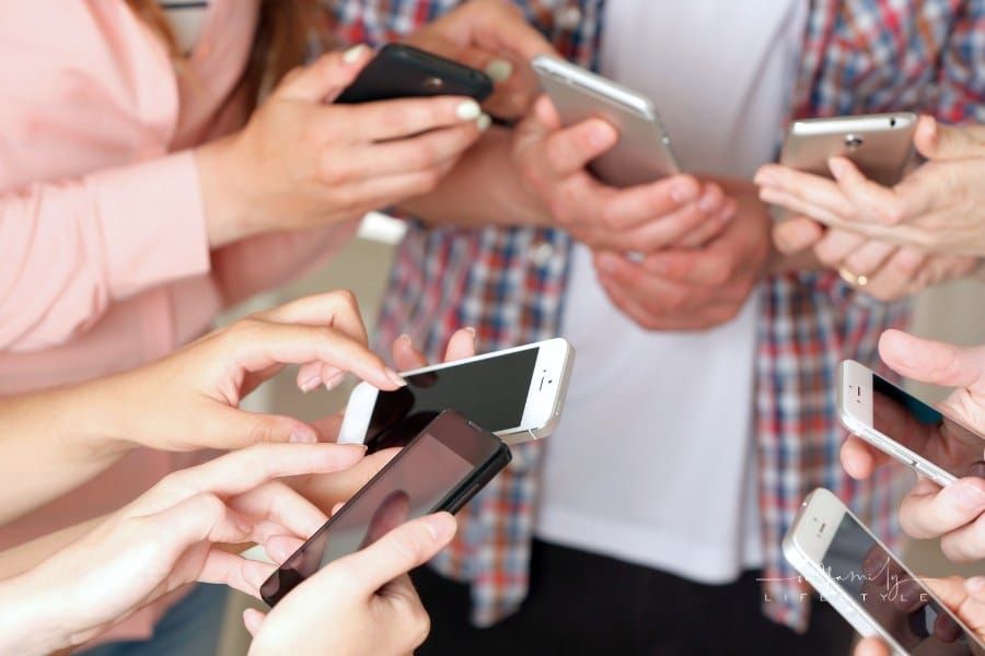 Many Hands Holding Mobile Phones