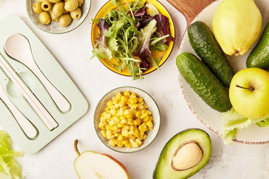 Plant based diet, Mediterranean diet - vegetables, fruits, greens, flax seeds ingredients with cutlery close up flat lay.