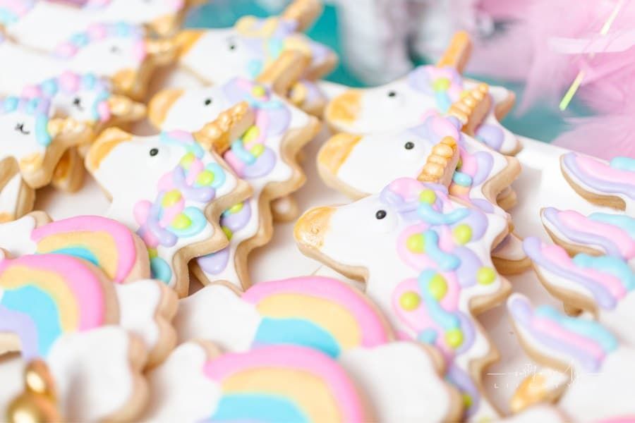 Unicorn sugar cookies decorated with royal icing at the kids birthday party.