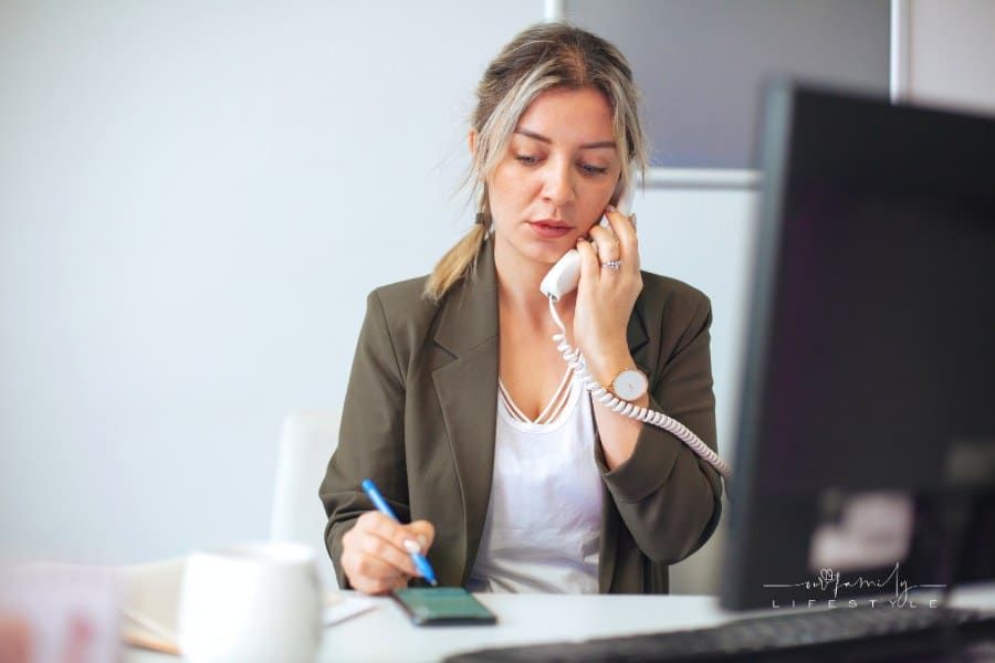 woman talking on phone in office