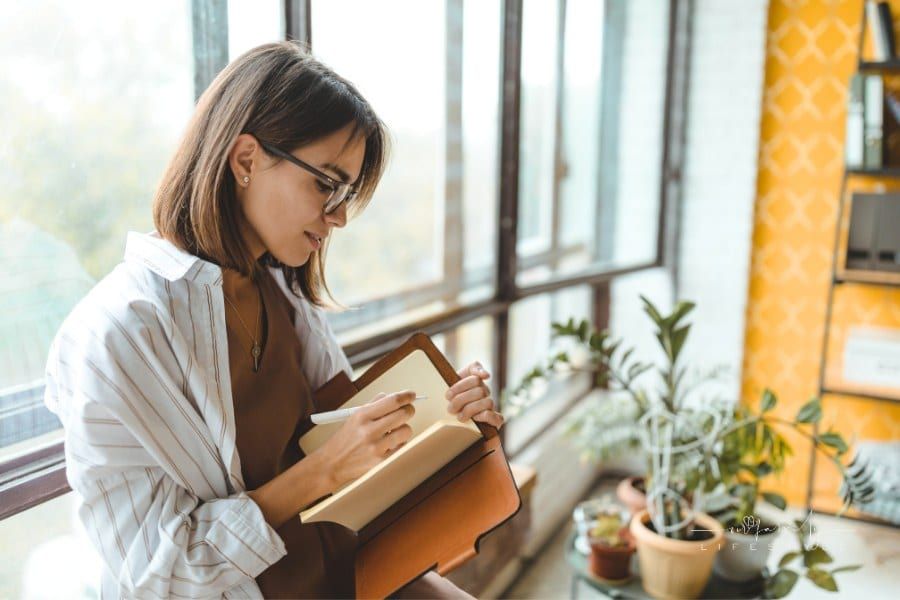 Woman Writing in Journal