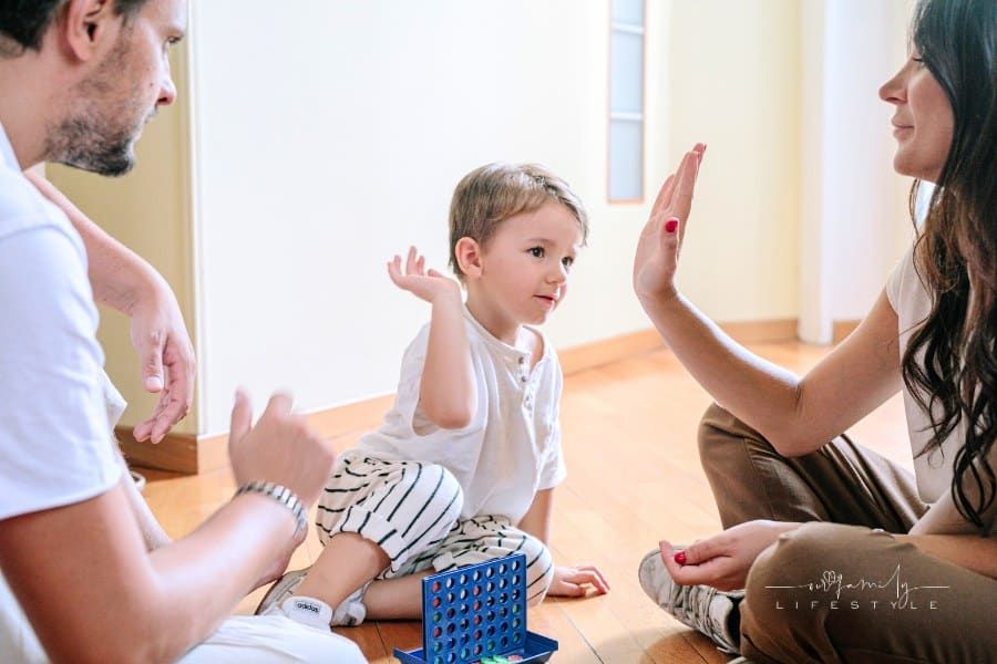 Child Playing with Parents at Home