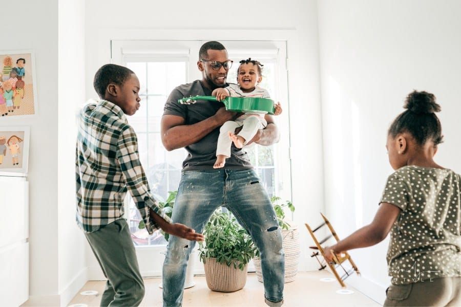 Dad and kids at home with musical instruments