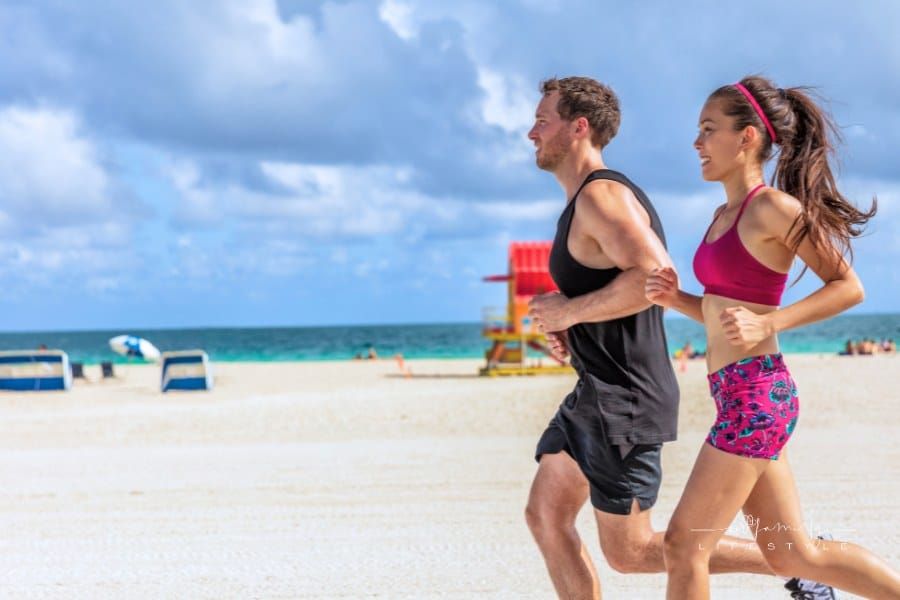 Couple Running Together at the Beach