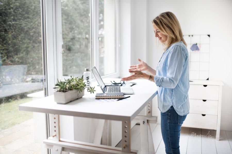 Woman Working at Ergonomic Standing Desk