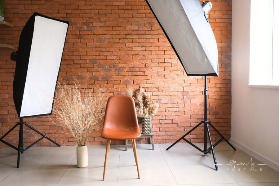 Interior of Modern Photo Studio with Brick Wall and brown leather chair