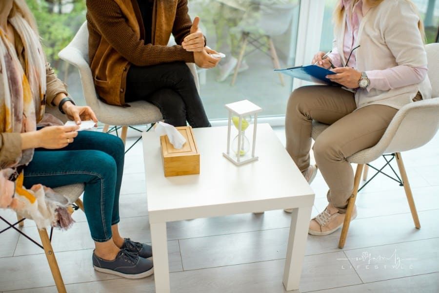 Couple Sitting with Psychologist during Therapy session
