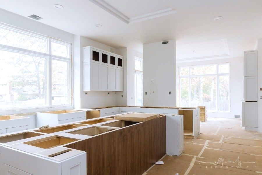 kitchen renovation with new cabinets waiting to be installed