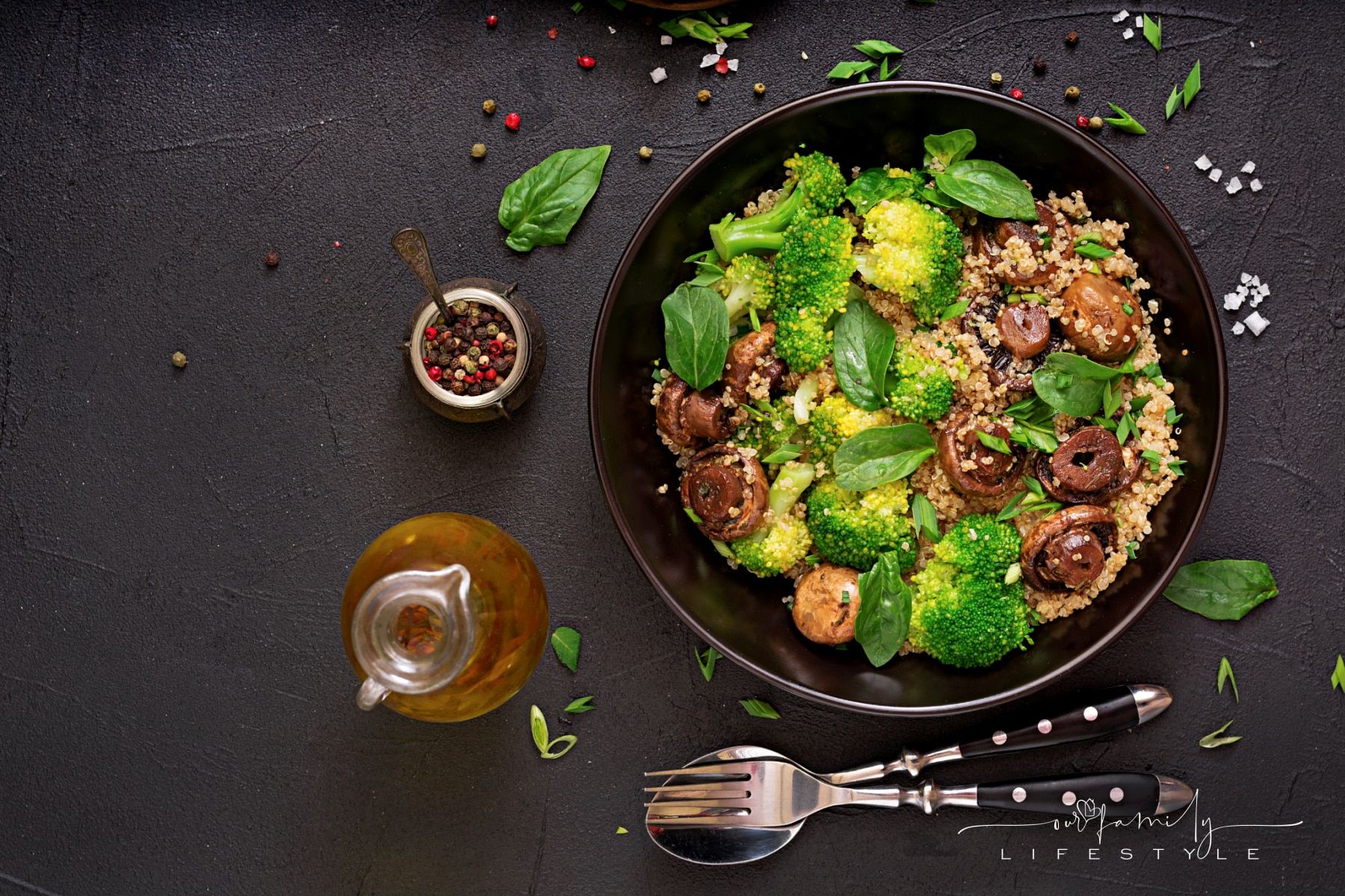 Healthy vegan salad of vegetables - broccoli, mushrooms, spinach and quinoa in a bowl