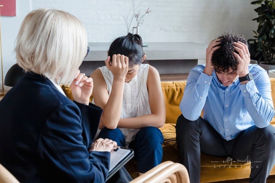 Couple with heads in their hands during Therapy Session