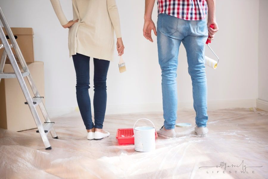 young-couple-painting-walls