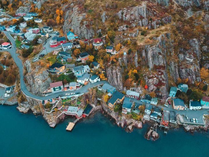 A breathtaking aerial view of a colorful coastal neighborhood in St. John's during fall.
