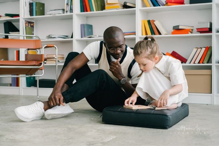 man observing child as they work through psychological evalutaion