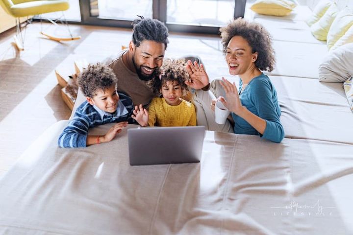 Family Video Calling on Laptop in the Living Room