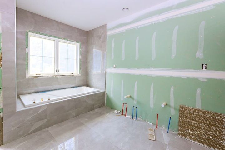 Under construction new bathtub remodeling a home bathroom, plumbing pipe for new sinks