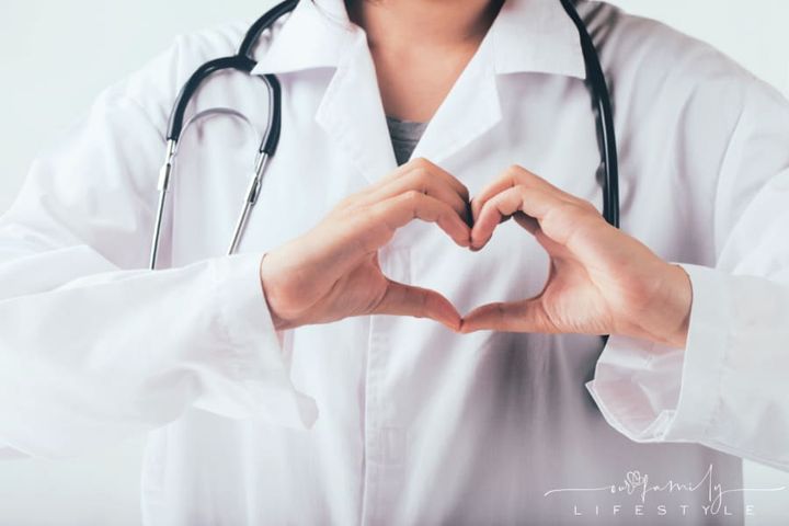Doctor making hands in heart shape