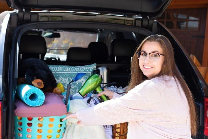 Freshman Girl Packing SUV for College