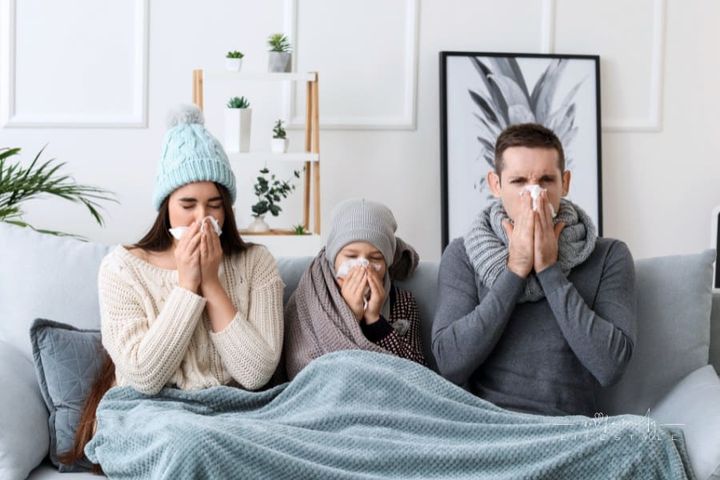 mom, dad, and son home on the cough with the flu