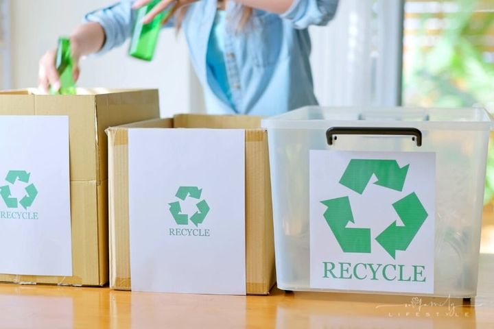 woman separating trash for recycling