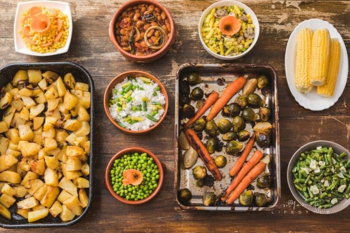 side dishes on wooden table, shot from above