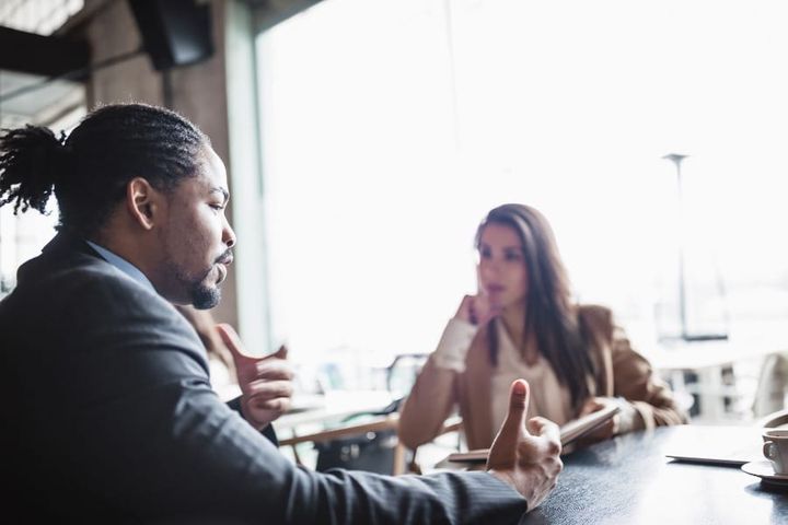 man talking to businesswoman during a job interview