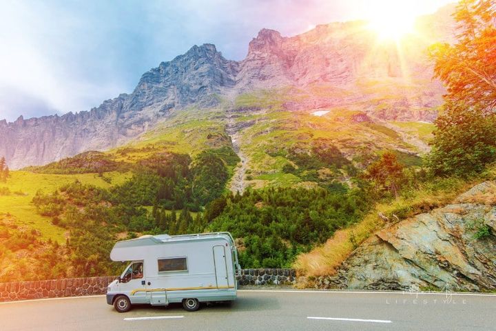 Camper Mountain Trip. Class C Camper Van on a Summer Mountain Road.