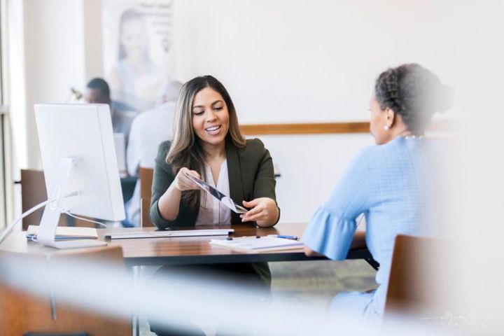 loan officer explaining collateral loans to client