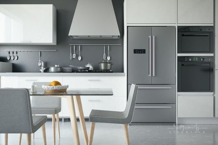 modern grey and white kitchen with stainless steel appliances