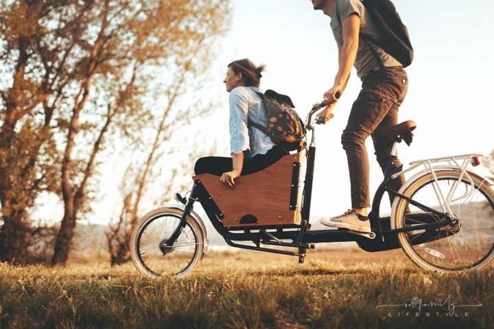 couple on cargo bike ride together