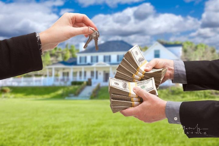 Man Handing Woman Cash for House Keys