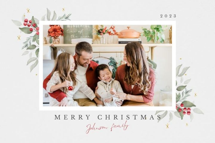 Family taking Christmas photos in kitchen for personalized Christmas cards