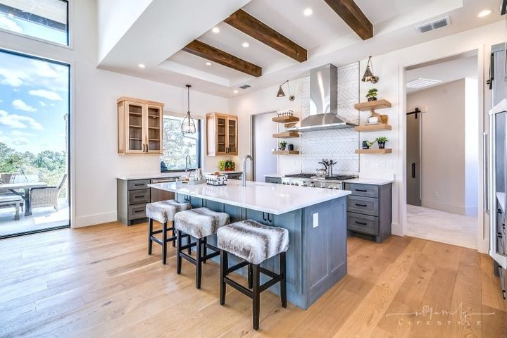 natural wood beams in white and gray kitchen