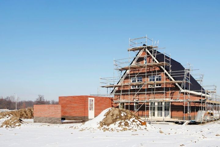 Construction site with scaffolding in snow